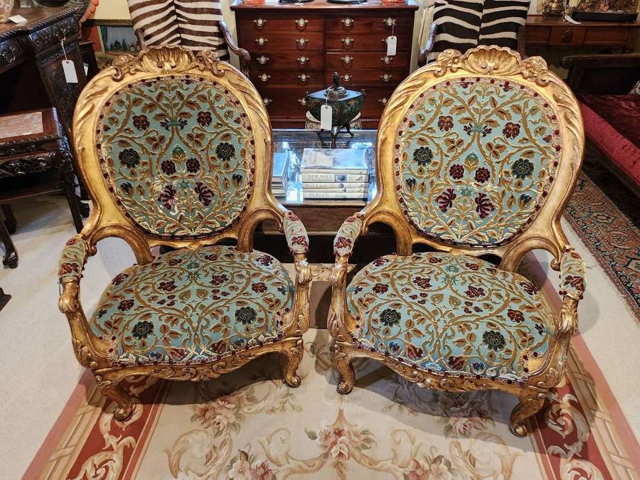 A Regal Pair of Giltwood Chairs
